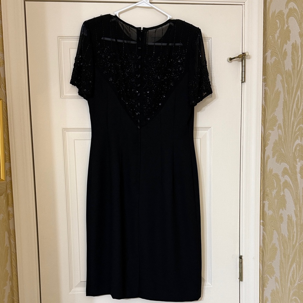 Donna Morgan little black dress. Size 4. Worn once. Gorgeous back detailing.